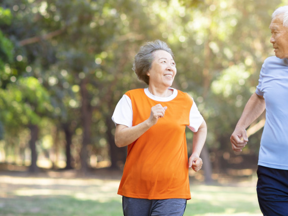 Photo of a elderly couple running