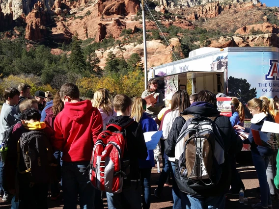 students around teaching trailer