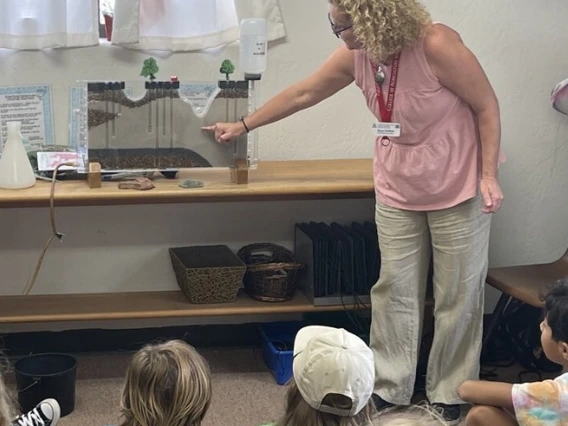 Instructor showing water display to students