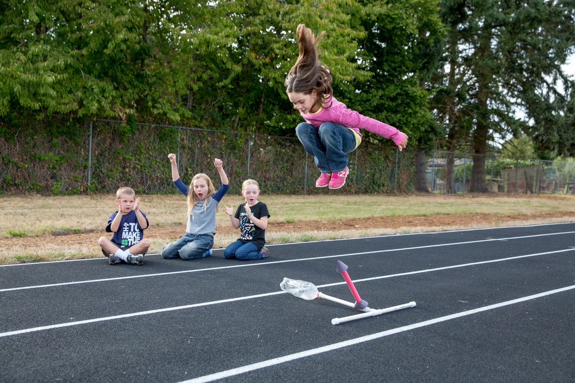 kid jumping on air rocket launcher