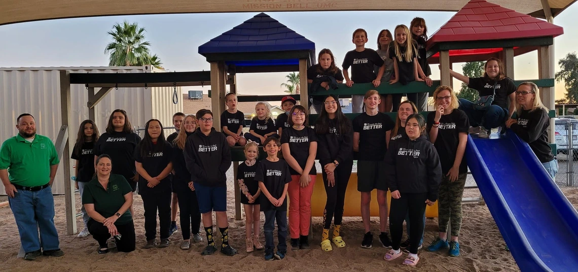 4-H youth taking group photo on playground