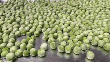 rozen peas on baking sheet